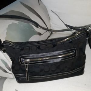 Coach black logo zipper pocket front